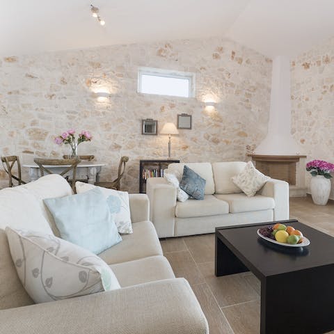 Curl up around the coffee table and thumb through a good book as you sip ouzo