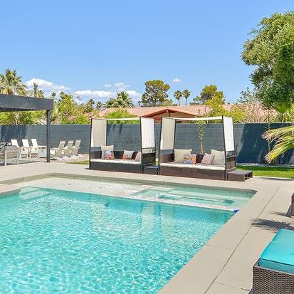 Lounge on the poolside daybeds with a good book