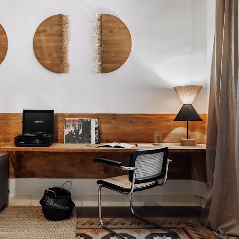 Settle down at the sleek workspace for a remote working session