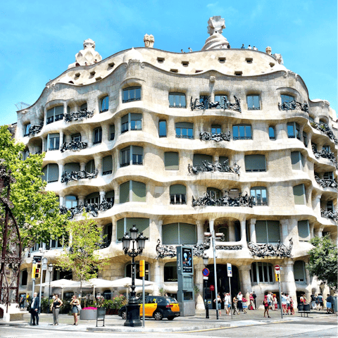 Take a tour of Gaudi's architecture, starting with Casa Milà nearby