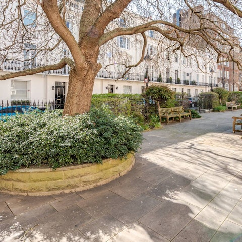 Sit on a bench with your morning coffee in Victoria Square, right outside the building