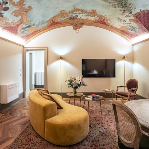 Admire the curved ceiling fresco of this charming home