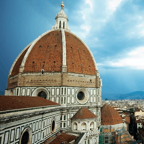 Eat gelato in the shade of the iconic Duomo