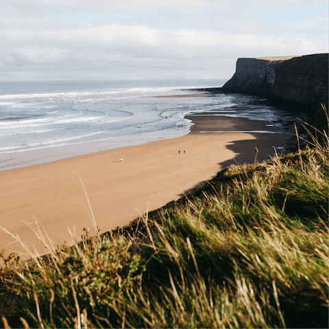 Feel the sand against your feet on Gullane Beach – a twelve-minute walk