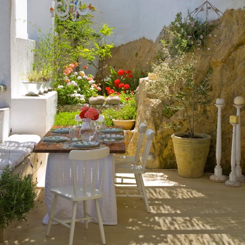 Enjoy dinner prepared by a personal chef in the verdant garden