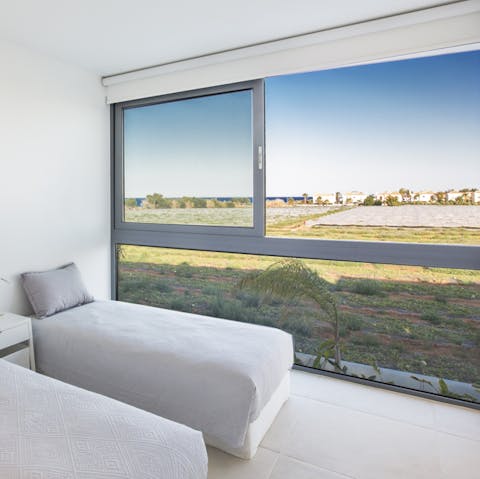 Gaze out to open fields and the sea as you doze off