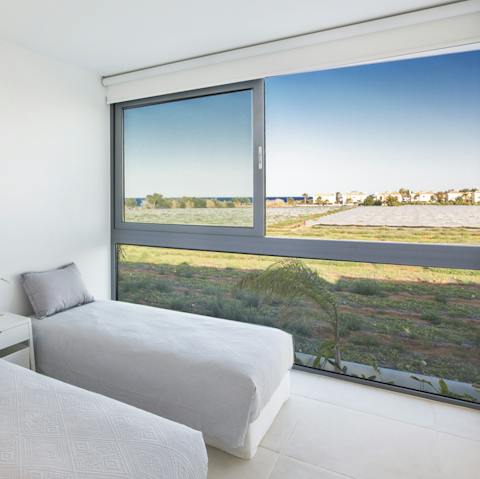 Gaze out to open fields and the sea as you doze off