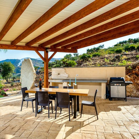 Rustle up a delicious home cooked meal paired with Italian wine at the outdoor kitchen
