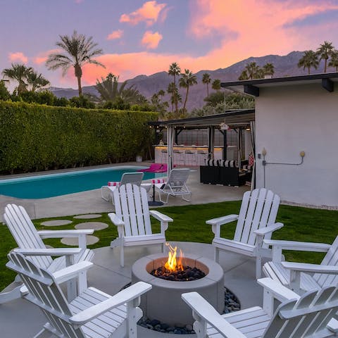 Sip cocktails around the fire pit and admire the mountain views