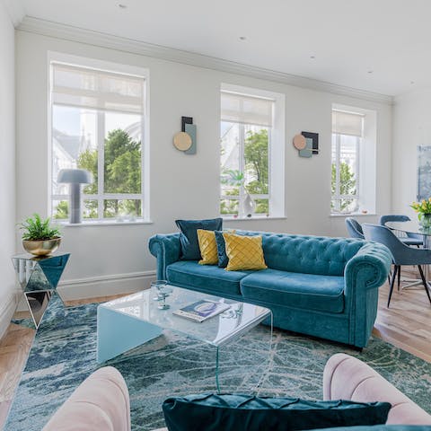 Kick back in the bright living room with a glass of wine after a day of exploring