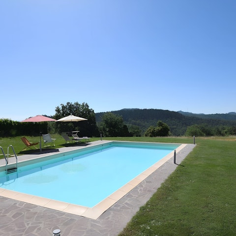 Enjoy beautiful views across Chianti while relaxing by the pool