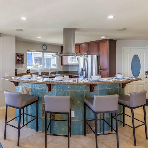 Gather around the breakfast bar for croissants, coffee and waffles