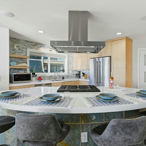 Gather around the breakfast bar for croissants, coffee and waffles