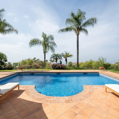 Enjoy lazy days by the pool or explore the nearby beaches