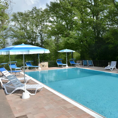 Spend lazy days relaxing by the communal pool