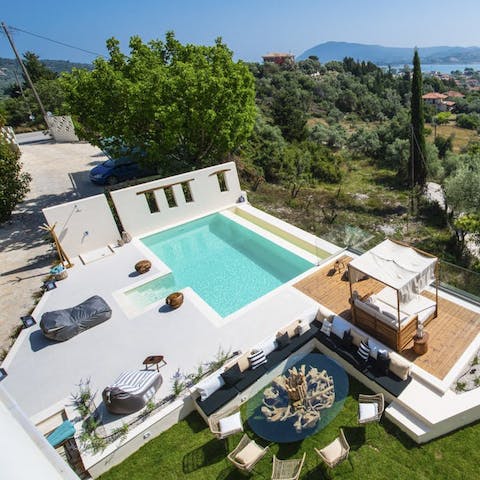 Lounge on a poolside day bed and dry off in the sun