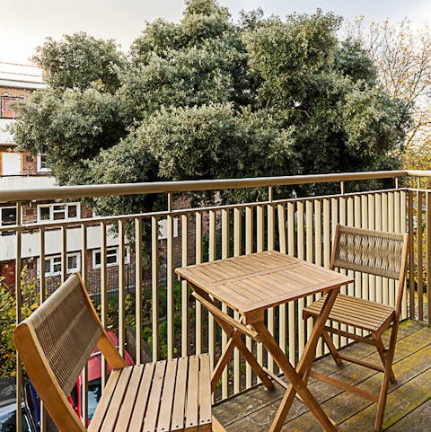 Unwind with a glass of wine on the private balcony