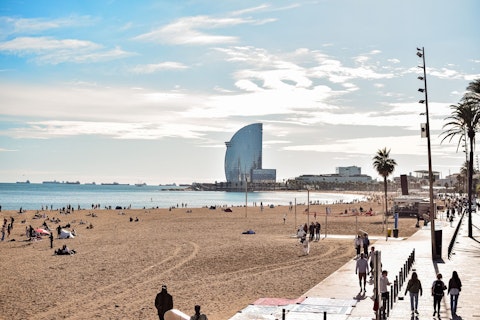 Relax on Barceloneta's golden urban beach, thirty minutes away by Metro