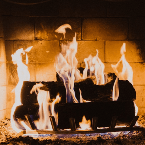 Snuggle up in front of the log burning stove