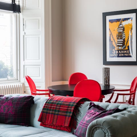 Lounge on the plush sofa or gather for a meal around the sleek dining table after a busy day