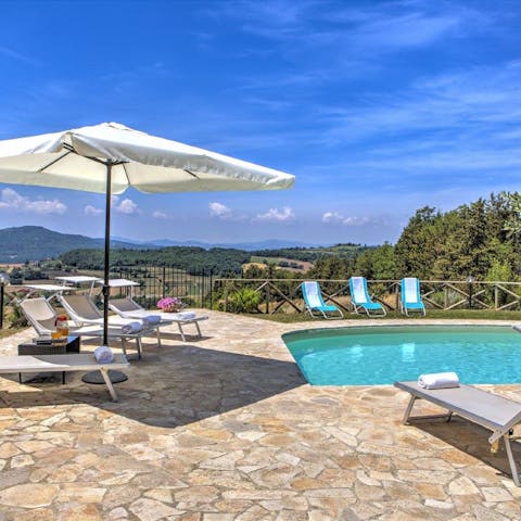 Cool off with a dip in the pool or a chilled glass of wine on the day beds