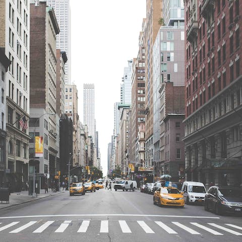 Catch and iconic yellow taxi to the Theatre District, a fifteen minute drive away