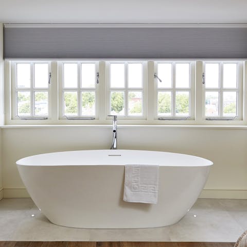 Enjoy a soak in the free-standing tub beneath the big windows