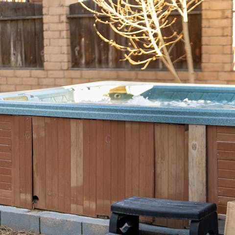 Relax in the open-air hot tub after the day's exertions