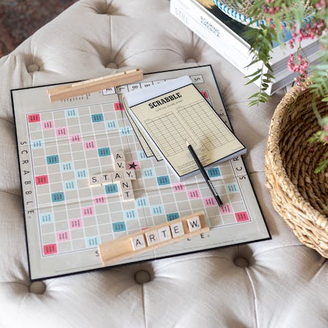 Wait out the rain with a board game in front of the log-burning fire
