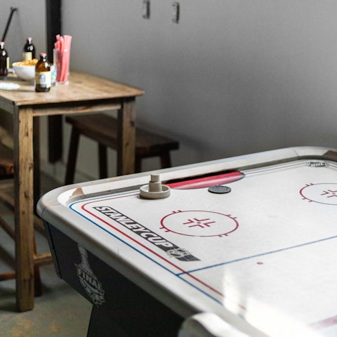 Hog the air hockey table in the home's games room