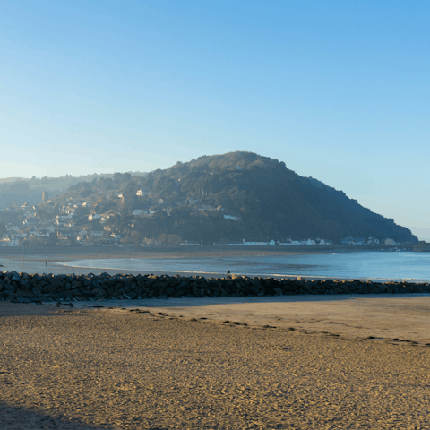 Soak up the sun as you stroll along Minehead beach