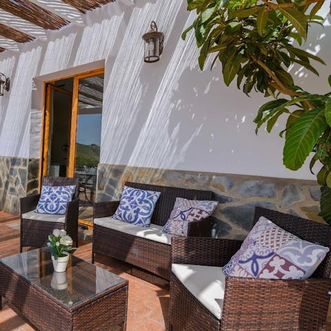 Sip a morning coffee or an evening sangria on the inviting outdoor patio
