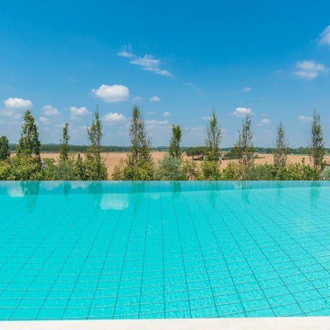 Sink into the cool clear water of the large communal pool