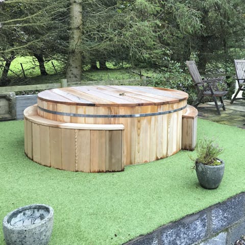 Unwind in the warmth of the outdoor hot tub