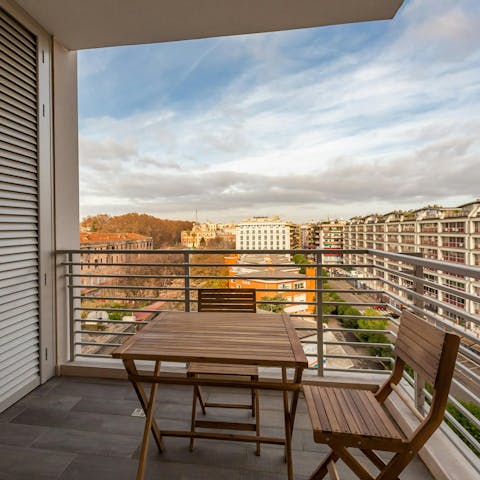 Enjoy a glass of Italian wine and take in the views over the district from the balcony