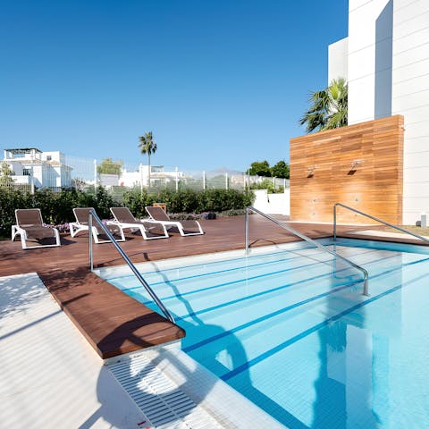 Slip into the pool for a refreshing dip after a lounging session