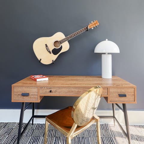 Get some work done in the private office – or just strum a tune on the guitar, instead