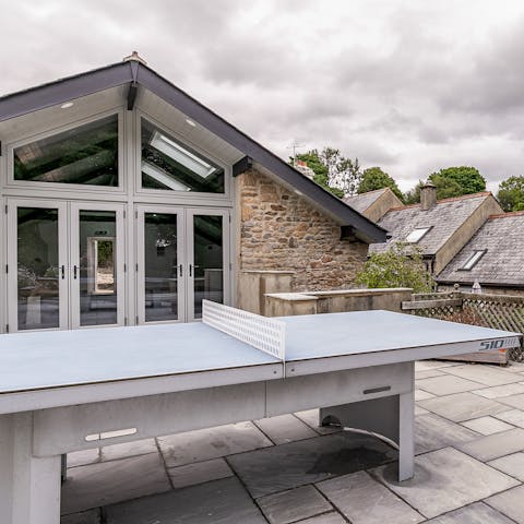 Get competitive over a game of ping pong on the patio