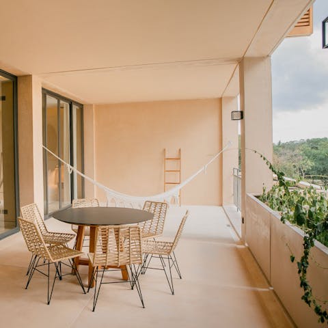 Relax in the hammock on your private balcony