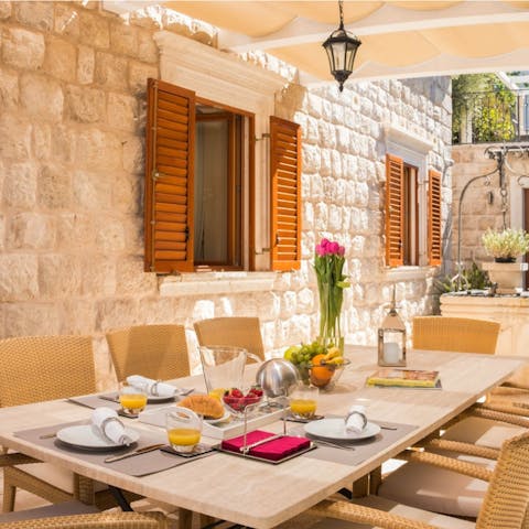 Sit beneath the pergola for fabulous family feasts