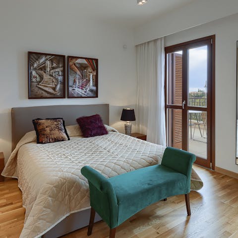 Wake up to sunlight through the glass doors to the balcony and expansive views