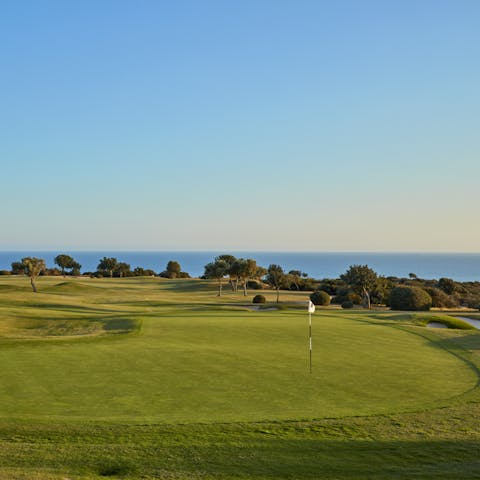 Shoot some holes on the green offered by the resort and let the hours melt away under the sun