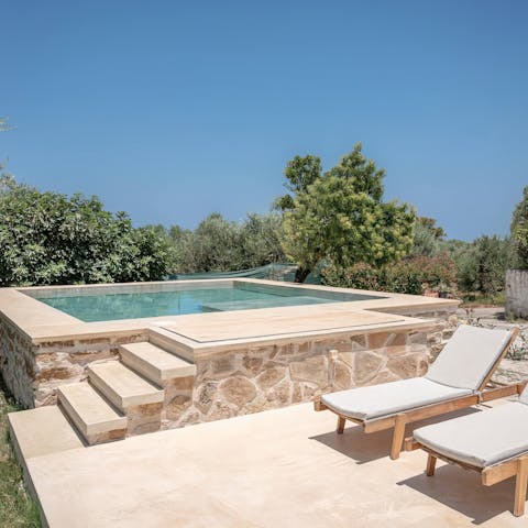 Embrace leisurely days relaxing by the private pool