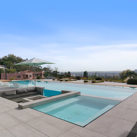 Enjoy incredible views while swimming in the heated pool