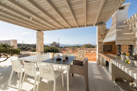 Fire up the traditional stone barbecue and enjoy a feast underneath the covered terrace