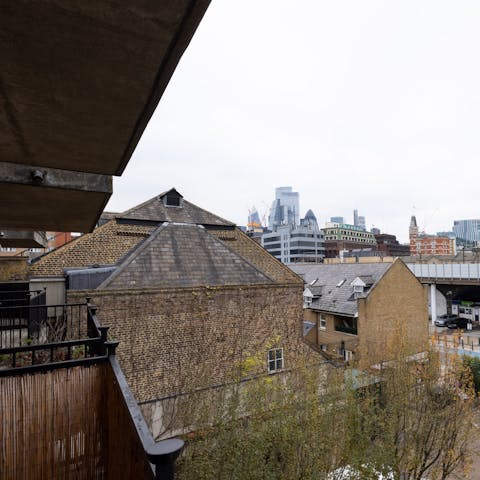 Look out over the city skyline from your private balcony