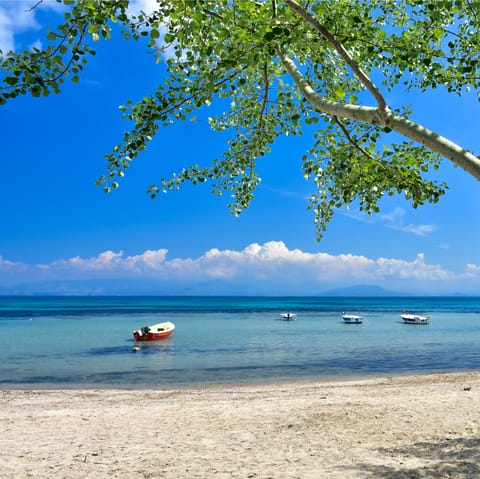 Stay in the idyllic village of Benitses on Corfu, 100m from the beach
