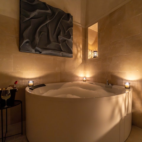 Unwind in the relaxation area with a soak in the Jacuzzi bathtub