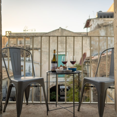 Sip an alfresco drink on the private balcony