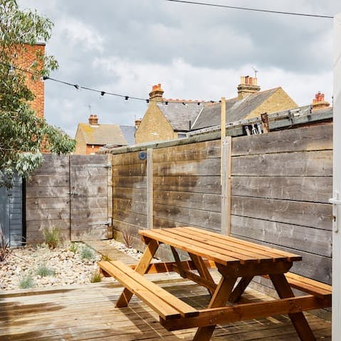 Enjoy the sun at the picnic bench in the garden